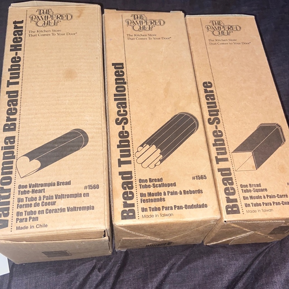 Three The Pampered Chef bread tubes. A square, scalloped, and heart shape.